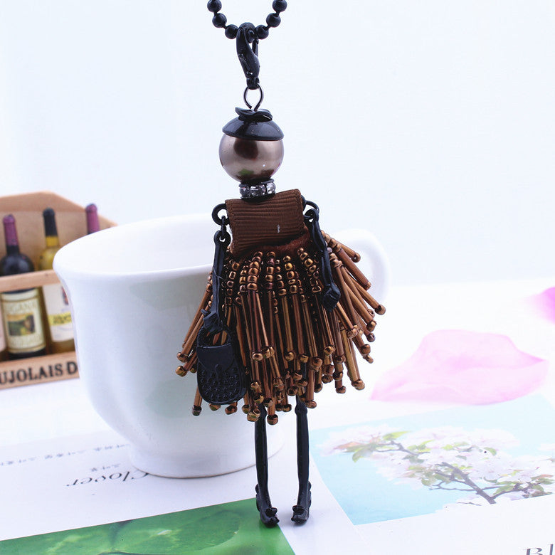 Long neck chain with Little Girl figure pendant