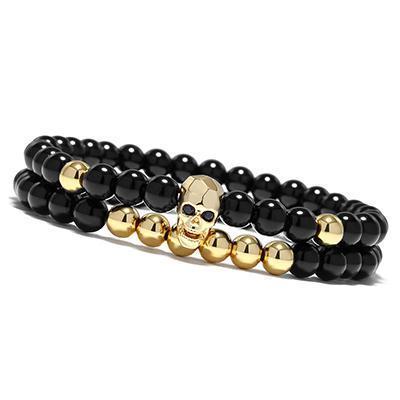 Double row skull bracelet gold