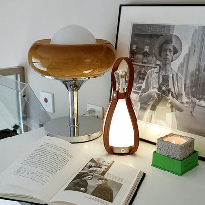 A portable night lamp in the shape of a wine bottle