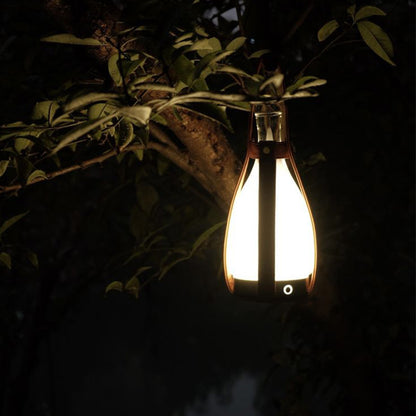 A portable night lamp in the shape of a wine bottle