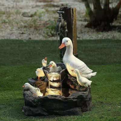 Garden statue with lighting duck family